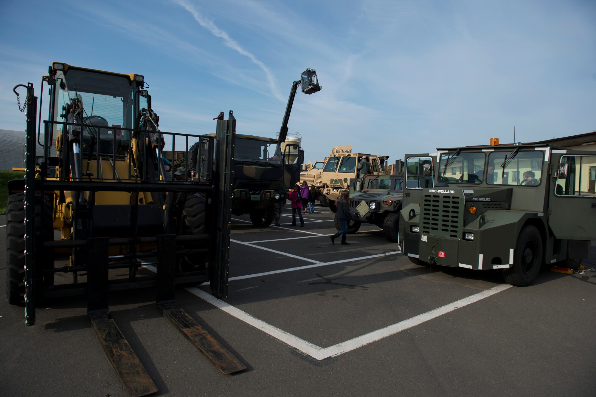 Students from Spangdahlem Elementary School check out military vehicles during Kids’ Deployment Day at Spangdahlem Air Base, Germany, April 29, 2015. Children interacted with multiple vehicles including security forces patrol cars and a fire truck as a part of their simulated deployment to Rio De Janeiro. (U.S. Air Force photo by Airman 1st Class Luke Kitterman/Released) 