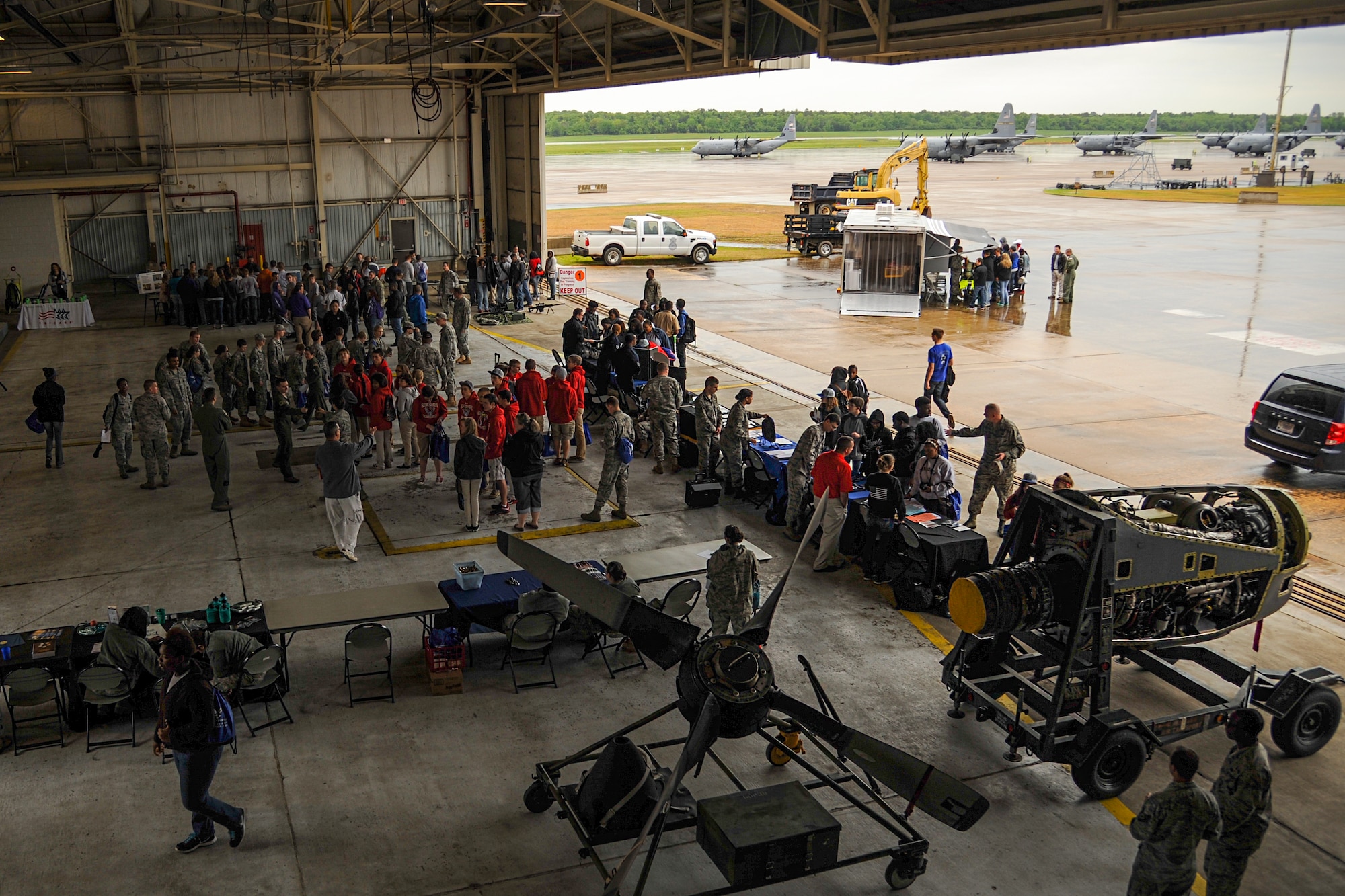 High school students from regional Junior ROTC programs view displays from different agencies and squadrons inside Hangar 233 April 23, 2015, at Little Rock Air Force Base, Ark. The demonstration was part of the annual Junior ROTC Expo that provides an overview of the mission at Little Rock AFB. (U.S. Air Force photo by Senior Airman Harry Brexel)