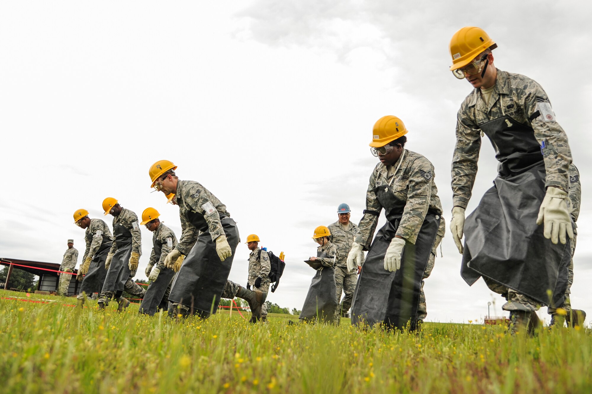 Members of the 19th Force Support Squadron recovery team search for simulated remains during a major accident response inspection April 22, 2015, in Jacksonville, Ark. The exercise tested response efforts of base and local agencies during an aircraft incident. (U.S. Air Force photo by Senior Airman Harry Brexel)