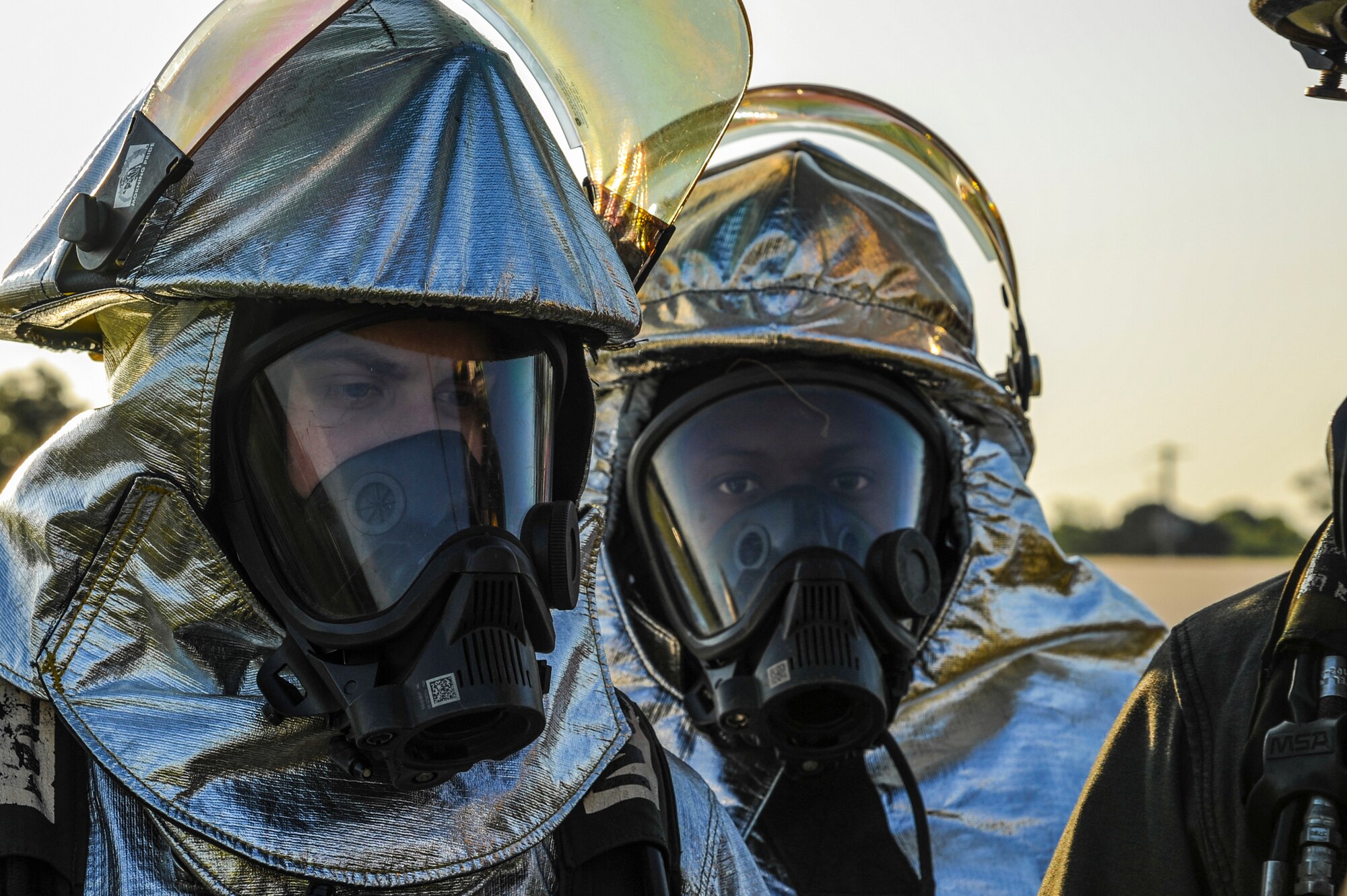 Staff Sgt. Nathan Williams and Senior Airman Justin Caldwell, 19th Civil Engineer Squadron firefighters, prepare to enter the scene of a simulated C-130 crash April 22, 2015, in Jacksonville, Ark. The replicated crash site was part of a major accident response inspection that tested the readiness of Airmen from more than five different Little Rock Air Force Base squadrons. (U.S. Air Force photo by Senior Airman Harry Brexel)