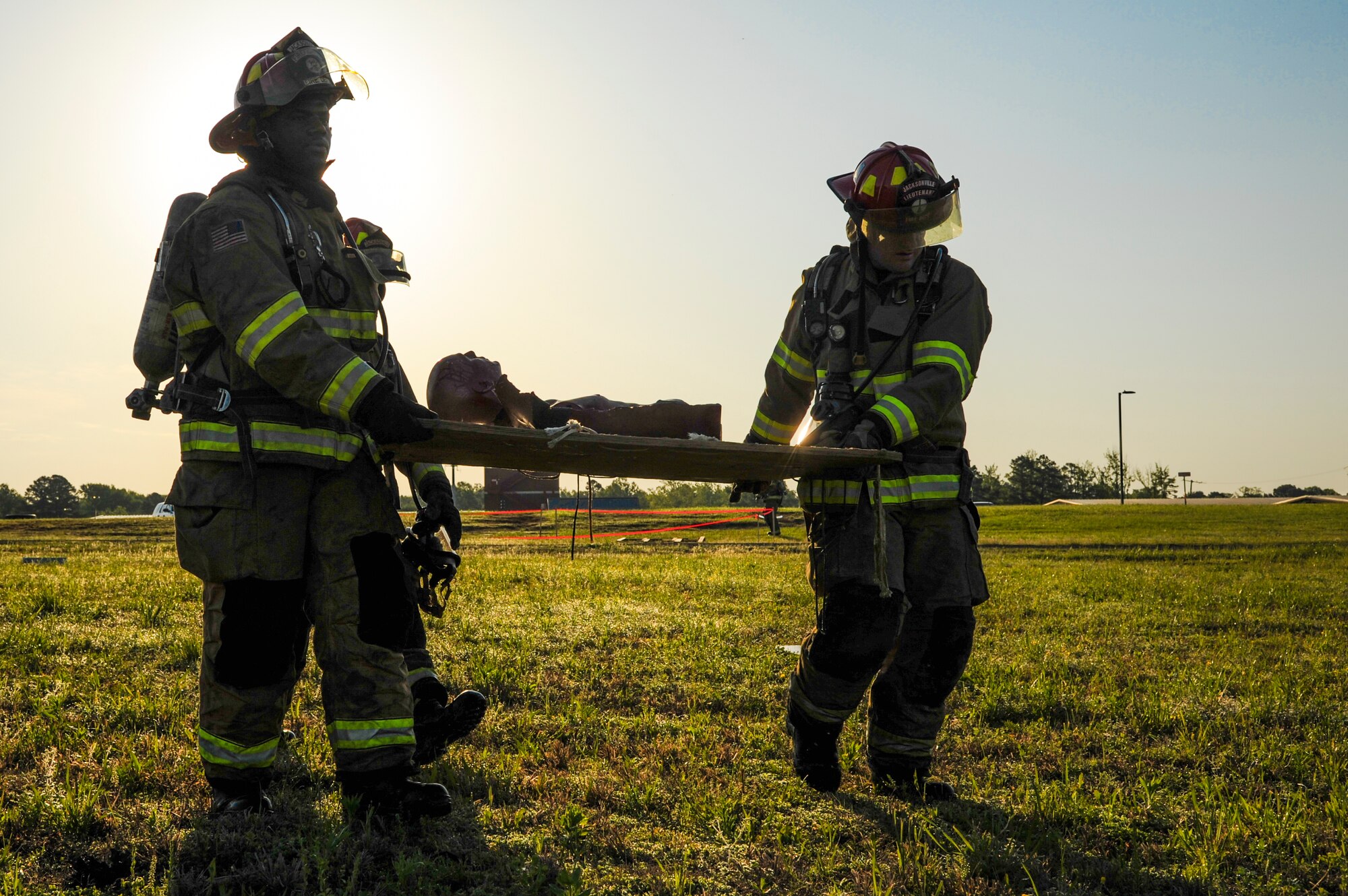Members of the Jacksonville Fire Department evacuate a simulated victim during a major accident response inspection April 22, 2015, in Jacksonville, Ark. The exercise tested Airmen and local authorities on response efforts during an aircraft accident. (U.S. Air Force photo by Senior Airman Harry Brexel) 