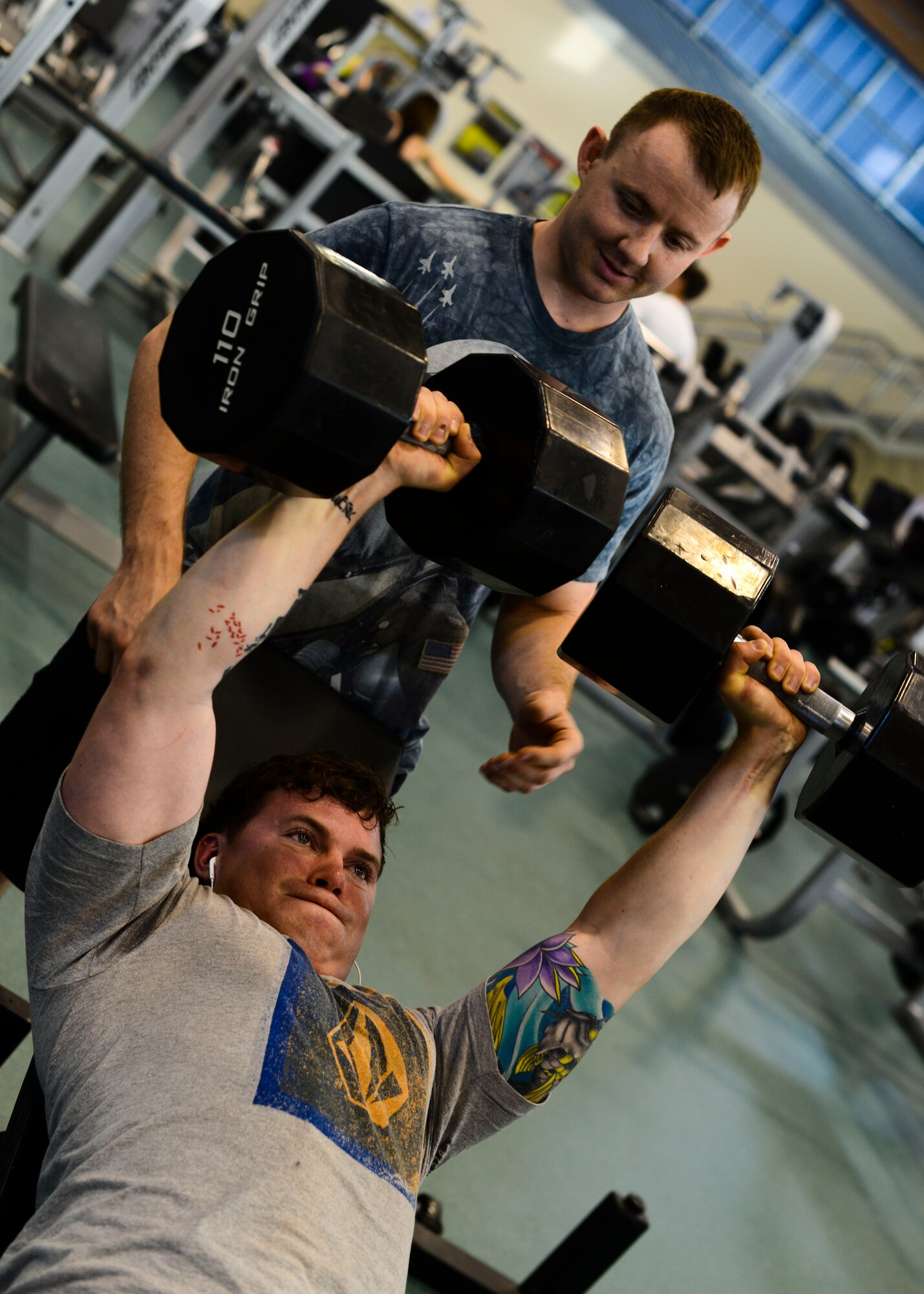 U.S. Air Force Senior Airman Sam Bassin, 31st Civil Engineer Squadron explosive ordnance disposal journeyman, spots Senior Airman Josiah Hamernick, 31 CES EOD apprentice, during a workout April 23, 2015, at Aviano Air Base, Italy. Airmen in EOD carry multiple explosives, tools, the bomb suit and sometimes even backpack-mounted robots on missions. This requires them to maintain a high-level of physical fitness. (U.S. Air Force photo by Senior Airman Austin Harvill/Released)