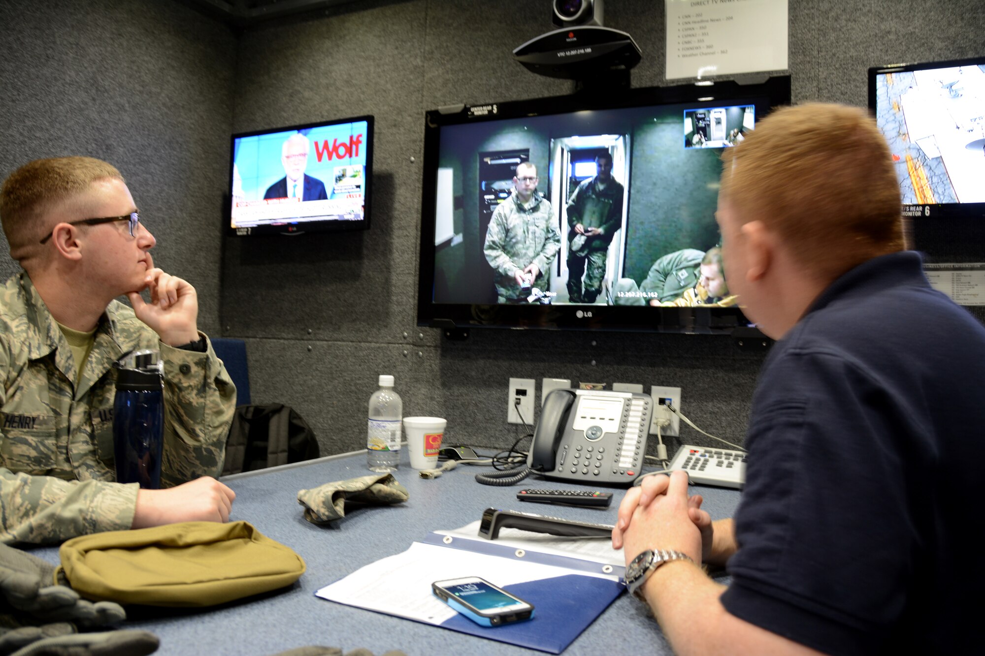 U.S. Air Force Airman First Class Bradley Henry, radio frequency system operator for the 156th Aeromedical Evacuation Squadron and Mark Fow, a contractor with the 145th Airlift Wing Emergency Management, test and administer a video teleconference in the North Carolina Air National Guard, Mobile Emergency Operations Center (MEOC) during a N.C. Command and Communications Rally held in Greensboro, N.C., April 10, 2015. NCANG partnered with more than twenty Emergency Management agencies over a two-day period to test communications during a natural disaster exercise and to showcase each agency’s capabilities. The MEOC provides the community’s incident commanders with emergency response support and interoperable communications such as video-teleconferencing, satellite internet, a weather station, a long range on-scene camera and various radio systems. (U.S. Air National Guard photo by Senior Airman Laura Montgomery, 145th Public Affairs/Released)