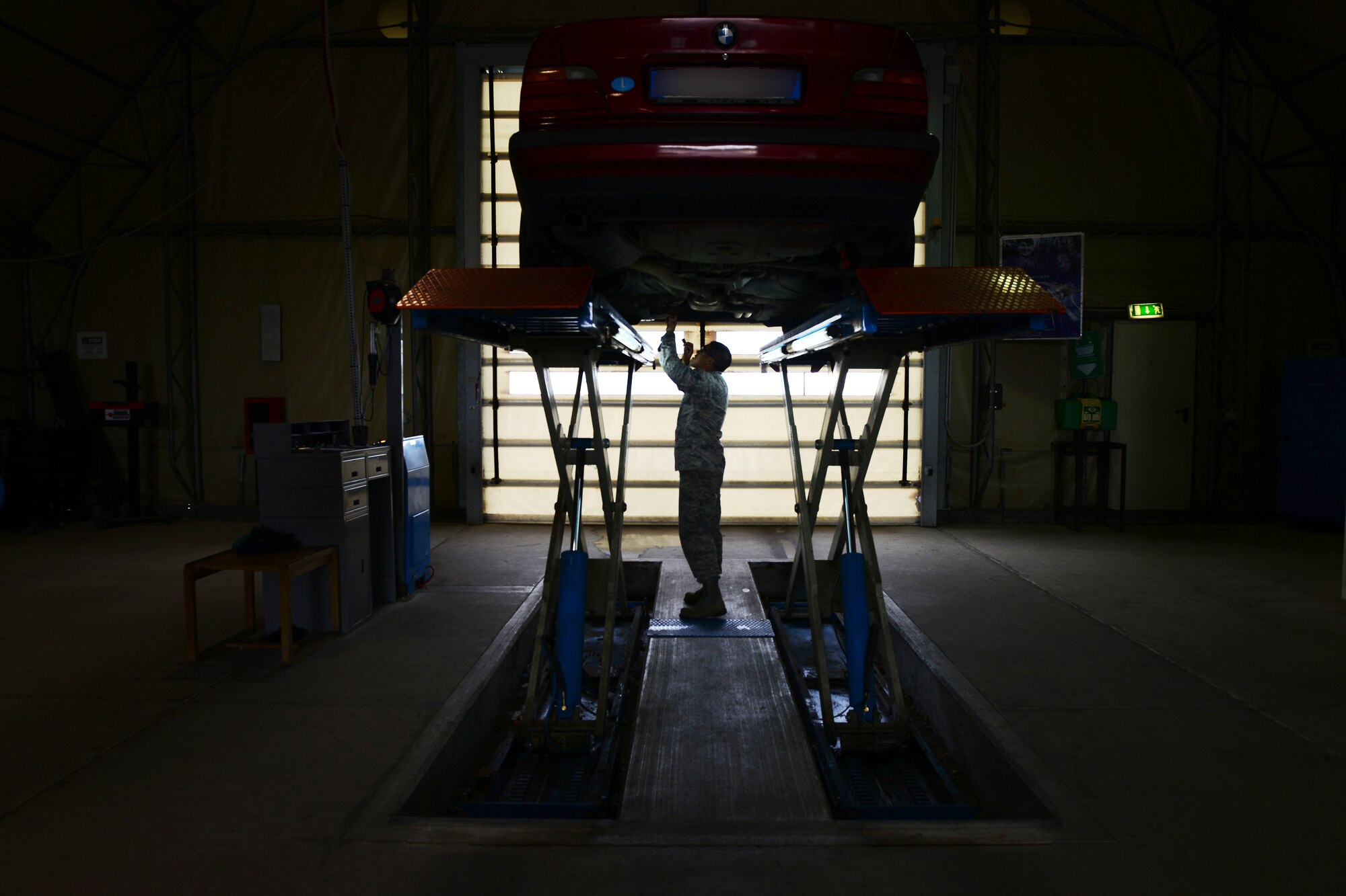 U.S. Air Force Senior Airman Justin Bow, 31st Logistics Readiness Squadron vehicle maintainer, inspects a vehicle, April 28, 2015, at Aviano Air Base, Italy. The 31 LRS vehicle inspectors are responsible for inspecting all privately owned vehicles to ensure their safety. These Airmen are responsible for checking vehicles’ brakes, tires and lights. (U.S. Air Force photo by Senior Airman Matthew Lotz/Released)