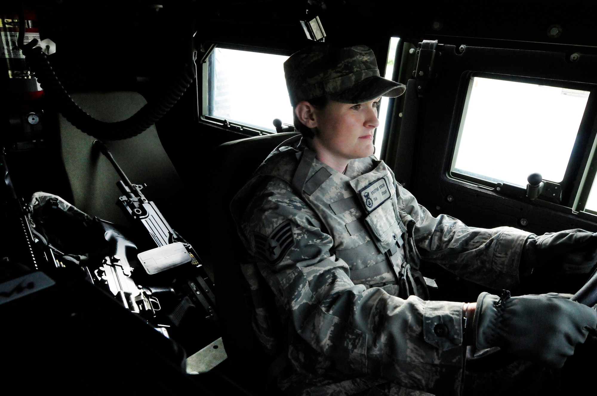 Newly promoted U.S. Air Force Staff Sgt. Kristine Koch, 145th Security Forces Squadron, starts an armored Humvee for patrol during a training exercise held in the Uwharrie National Forest, Troy, N.C., April 2, 2015. Koch, who completed her first Professional Military Education milestone, Feb 12, 2015, as a distinguished graduate from Airman Leadership School has been with 145th SFS since Oct 2012. (U.S. Air National Guard photo by Master Sgt. Patricia F. Moran, 145th Public Affairs/Released)