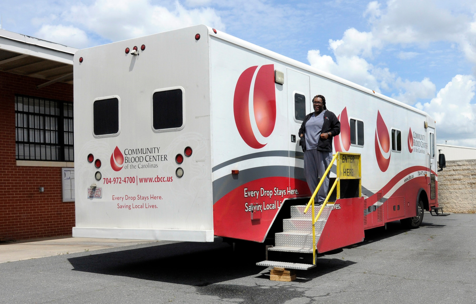A nurse exits the Community Blood Center of the Carolinas mobile blood donation unit during a blood drive held at the North Carolina Air National Guard base, Charlotte Douglas Intl. Airport, April 18, 2015.  CBCC is an organization that supplies blood to hospitals in the local Charlotte area. Donating one pint takes an hour or less, and in the end one walks away having saved up to three lives. (U.S. Air National Guard photo by Master Sgt. Patricia F. Moran, 145th Public Affairs/Released)