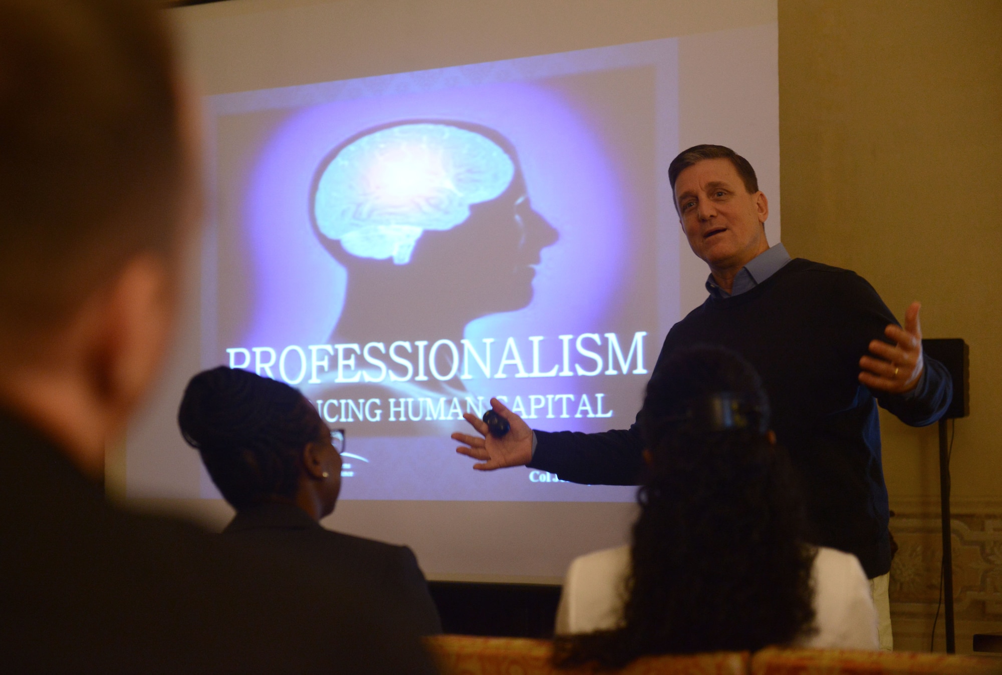U.S. Air Force Col. Jeffrey Smith, Air Force Profession of Arms Center of Excellence director, speaks to Aviano leadership during a professionalism seminar, April 20, 2015. The seminar led by Smith, spoke about the importance of understanding human psychology and how to develop environments that encourage increased levels of commitment, loyalty and trust. (U.S. Air Force photo by Staff Sgt. Evelyn Chavez/Unreleased)