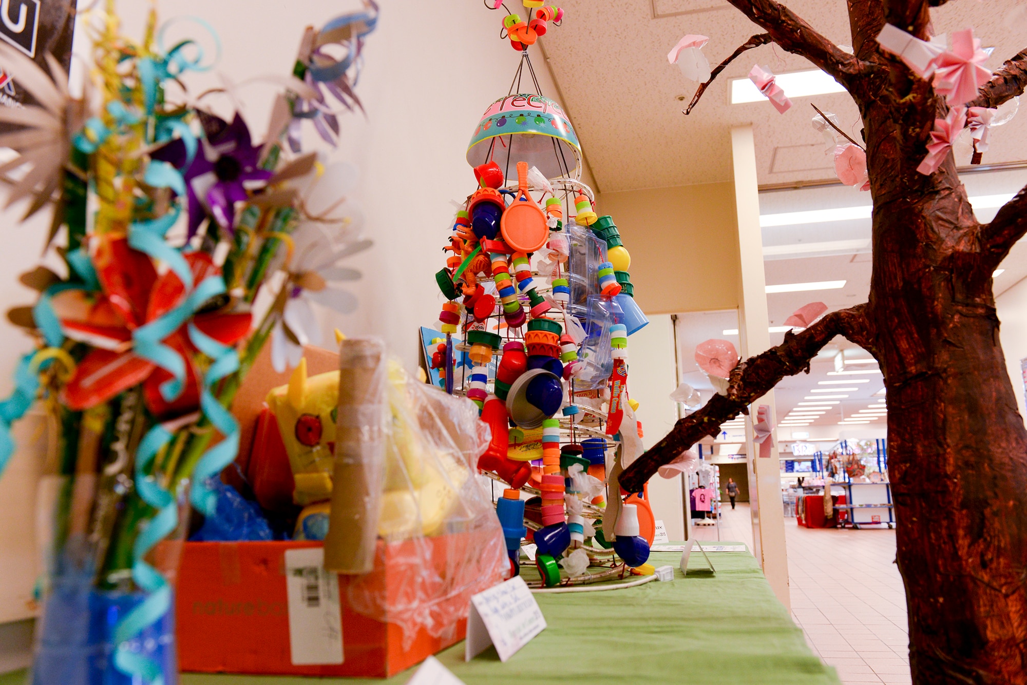 Entries for the Recycled Art Contest stand for judgment outside the base exchange April 22, 2015, at Yokota Air Base, Japan. Supporting Earth Week’s theme of “reduce, reuse, recycle,” artworks were composed of bits of plastic, discarded bottle caps, pieces of cardboard, styrofoam, old toys, bottles and more recycled materials. (U.S. Air Force photo by Airman 1st Class Elizabeth Baker/Released)