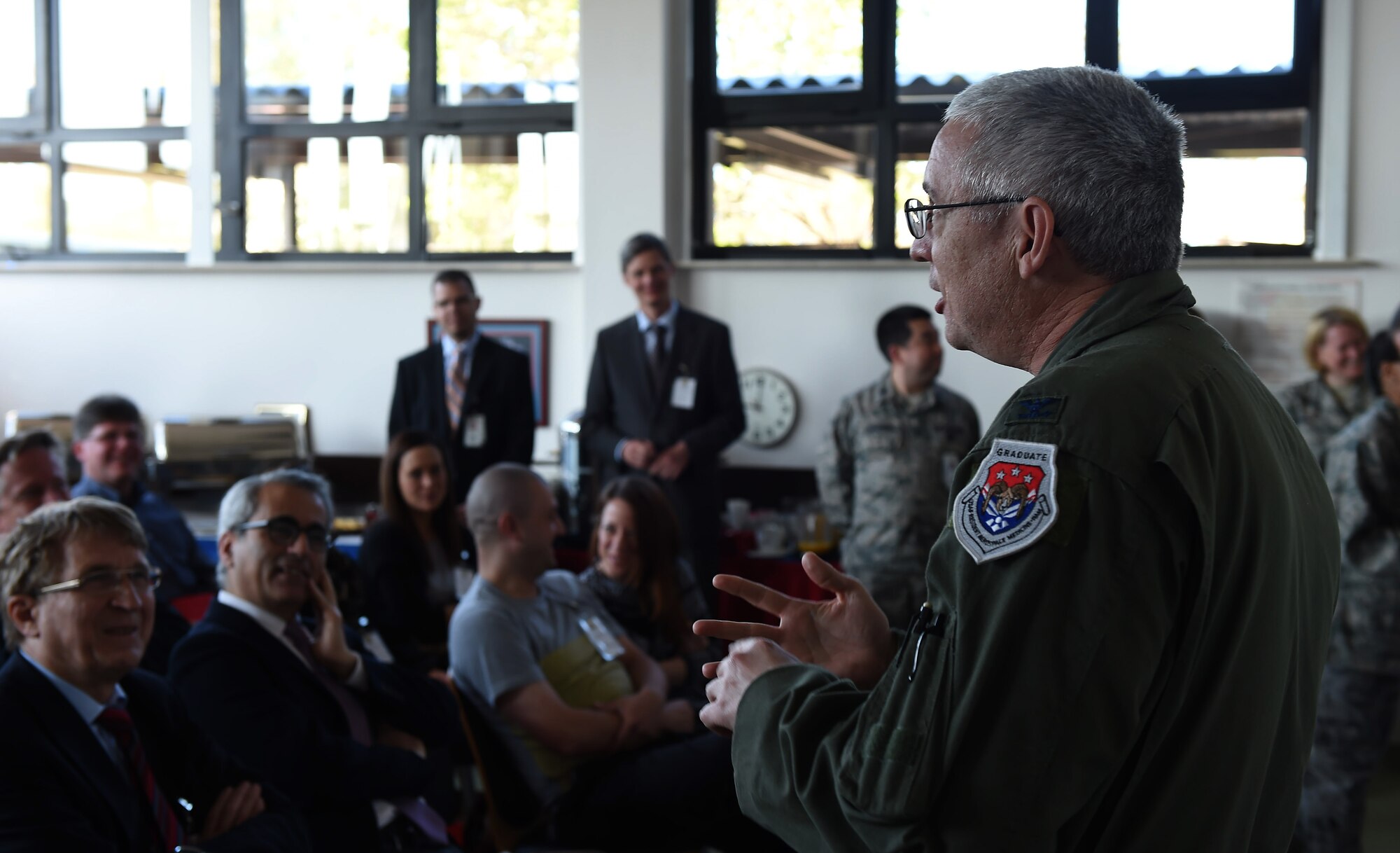 Col. Brian Agee, 86th Aerospace Medicine Squadron commander, briefs civilian health care providers from throughout Germany on the mission of the 86th AMDS during a visit April 23, 2015, at Ramstein Air Base, Germany. The visit allowed the 86th MDG to give more than 40 host nation providers an oversight of their mission and exchange knowledge to better serve patients. (U.S. Air Force photo/Senior Airman Damon Kasberg)