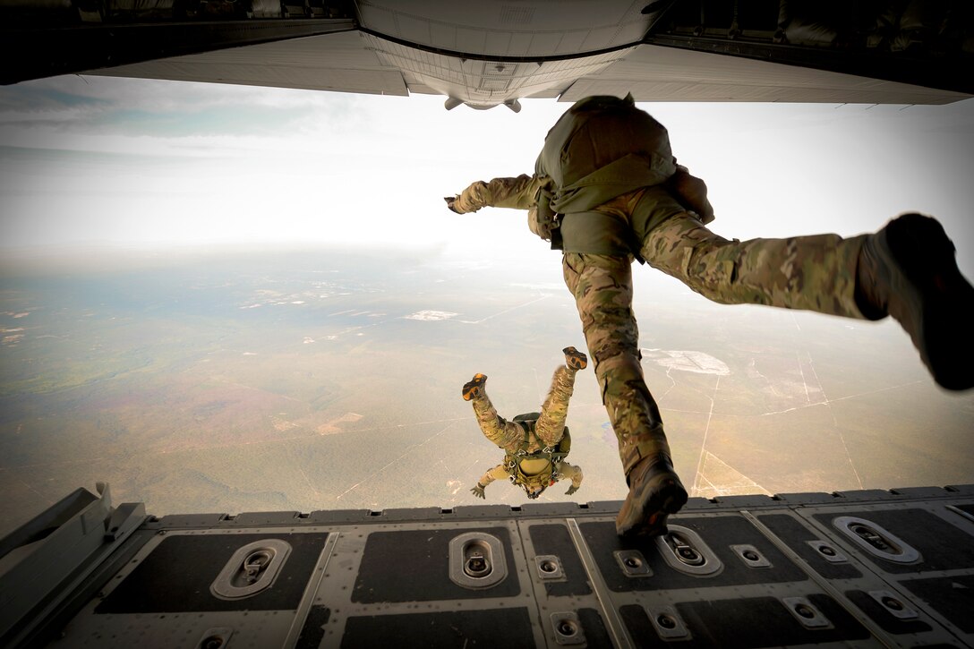 U.S. Army Green Berets jump out of a C-130H3 Hercules aircraft during Emerald Warrior at Hurlburt Field, Fla., April 22, 2015.