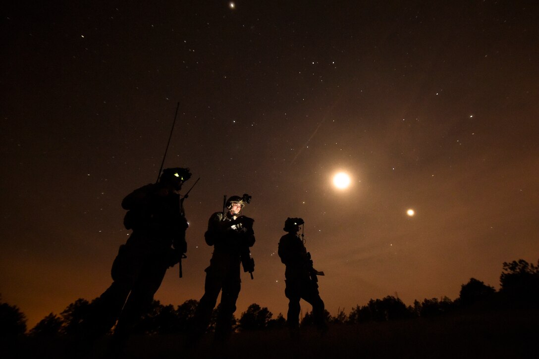 U.S. Air Force combat controllers, 21st Special Tactics Squadron, observe an AC-130 Gunship conduct a live-fire mission during Emerald Warrior at Camp Shelby, Miss., April 22, 2015.