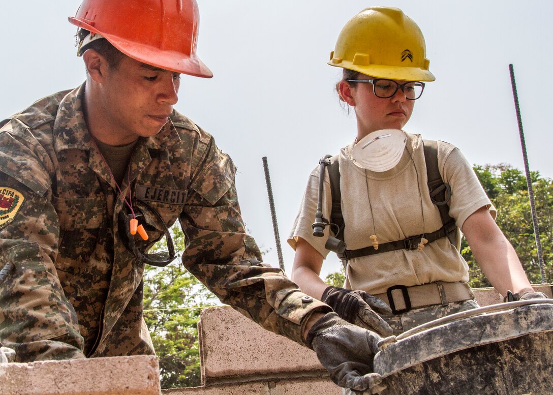 U.S. Army 1st  Lt. Ellen Poeschel, right, and Salvadoran army Pvt. Rene William Perez prepare to lay brick for the exterior wall of a school under construction during Beyond the Horizon 2015 in Chalchuapa, El Salvador, April 29, 2015. Beyond the Horizon is a humanitarian and civic assistance mission that last provides construction and medical assistance to the people of El Salvador. Poeschel is an engineer officer assigned to the 327th Engineer Company. 