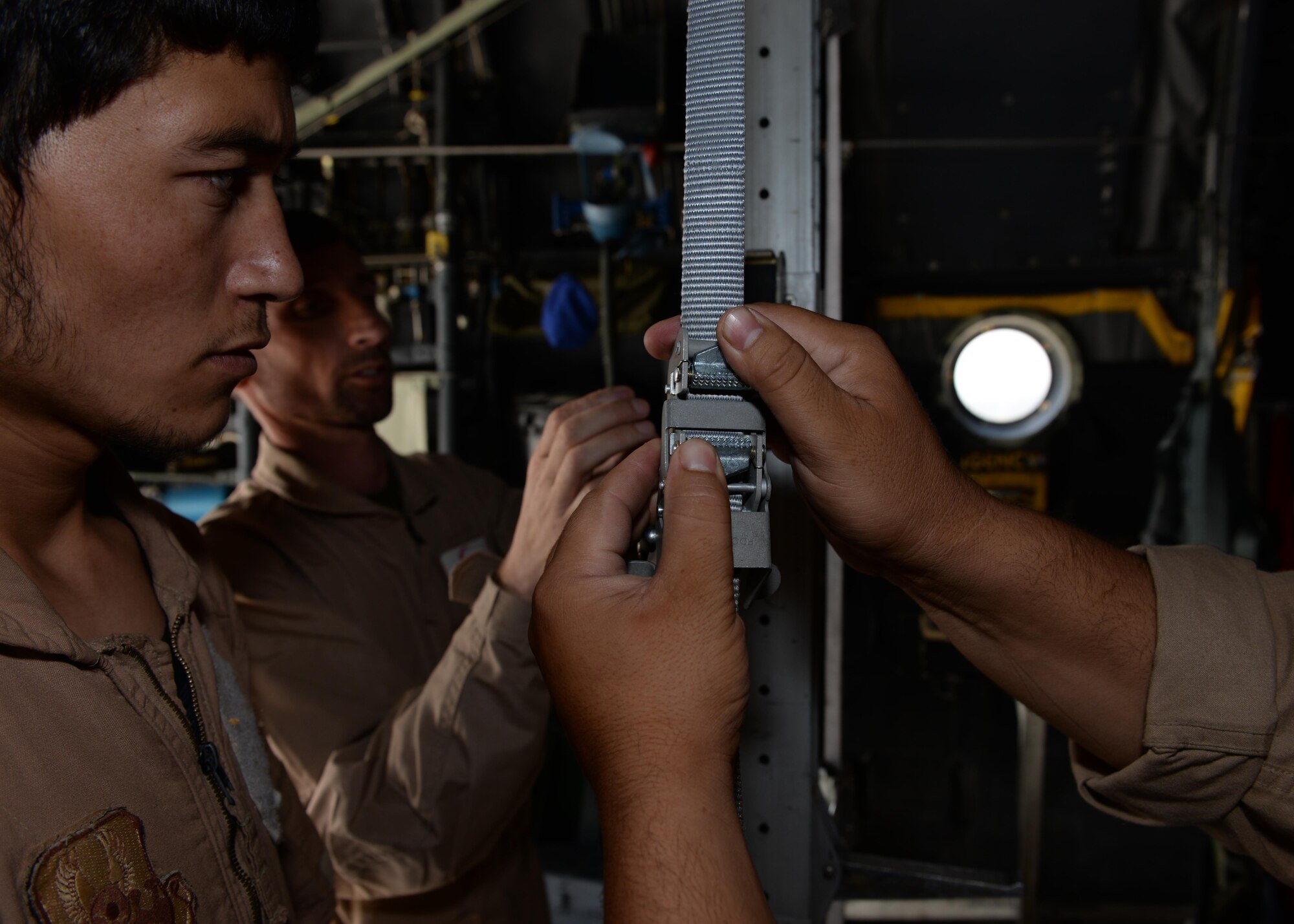 Members of the Afghan National Army medical evacuation team practice hands on MEDEVAC training with Train, Advise, Assist Command-Air advisors in a C-130H Hercules aircraft July 29, 2015, at Hamid Karzai International Airport, Kabul, Afghanistan. The TAAC-Air advisors host weekly training with the Afghan flight medics, with assistance from U.S. Air Force aeromedical evacuation subject matter experts. (U.S. Air Force photo by Senior Airman Cierra Presentado/Released)