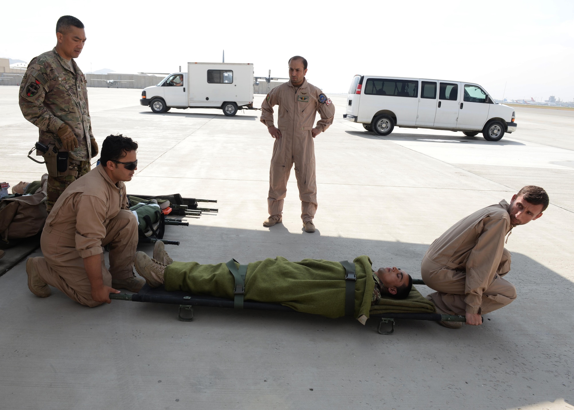 Members of the Afghan National Army medical evacuation team practices hands on MEDEVAC training with Train, Advise, Assist Command-Air advisors July 29, 2015, at Hamid Karzai International Airport, Kabul, Afghanistan. The TAAC-Air advisors host weekly training with the Afghan flight medics, with assistance from U.S. Air Force aeromedical evacuation subject matter experts. (U.S. Air Force photo by Senior Airman Cierra Presentado/Released)
