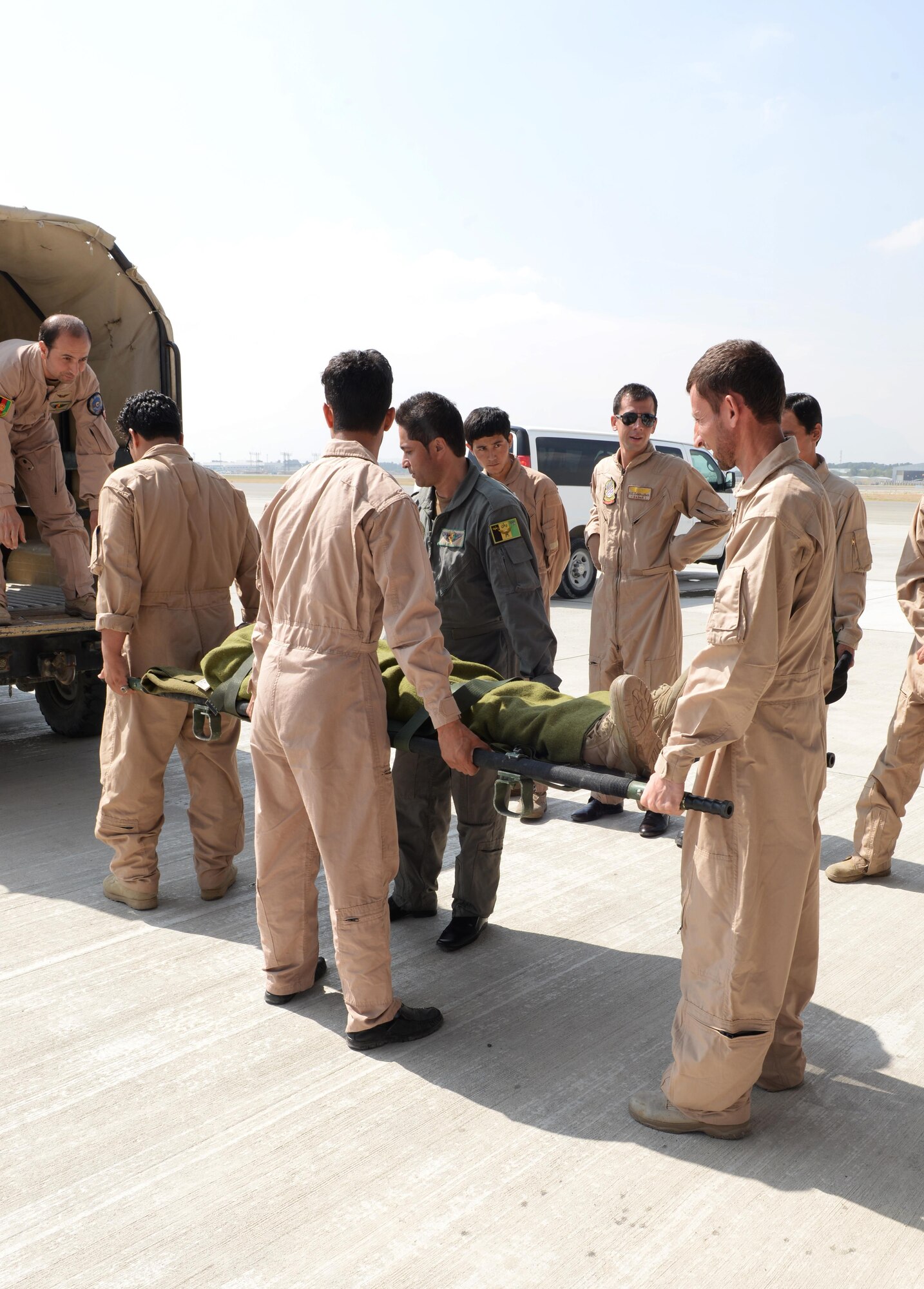 Members of the Afghan National Army medical evacuation team practices hands on MEDEVAC training with Train, Advise, Assist Command-Air advisors July 29, 2015, at Hamid Karzai International Airport, Kabul, Afghanistan. The TAAC-Air advisors host weekly training with the Afghan flight medics, with assistance from U.S. Air Force aeromedical evacuation subject matter experts. (U.S. Air Force photo by Senior Airman Cierra Presentado/Released)