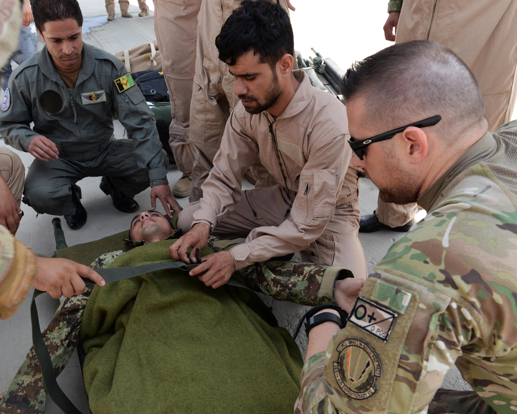 Members of the Afghan National Army medical evacuation team practices hands on MEDEVAC training with Train, Advise, Assist Command-Air advisors July 29, 2015, at Hamid Karzai International Airport, Kabul, Afghanistan. The TAAC-Air advisors host weekly training with the Afghan flight medics, with assistance from U.S. Air Force aeromedical evacuation subject matter experts. (U.S. Air Force photo by Senior Airman Cierra Presentado/Released)
