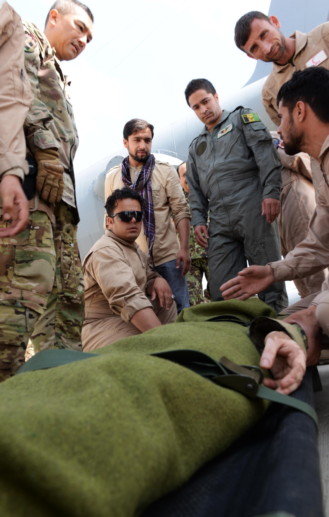 Members of the Afghan National Army medical evacuation team practices hands on MEDEVAC training with Train, Advise, Assist Command-Air advisors July 29, 2015, at Hamid Karzai International Airport, Kabul, Afghanistan. The TAAC-Air advisors host weekly training with the Afghan flight medics, with assistance from U.S. Air Force aeromedical evacuation subject matter experts. (U.S. Air Force photo by Senior Airman Cierra Presentado/Released)
