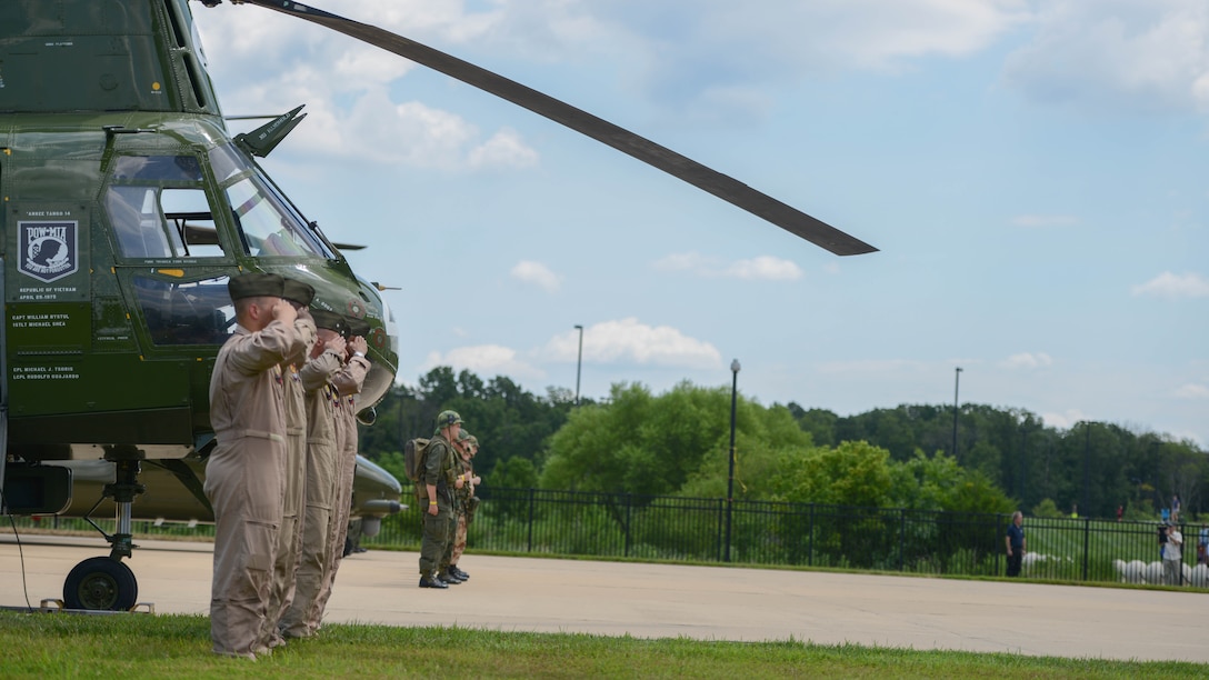 Marines with Marine Medium Helicopter Squadron 774 salute during the playing of Anchors’ Aweigh and the Marines Hymn Aug. 1, 2015 during the CH-46 Last Flight Retirement Ceremony at the Smithsonian Institution Nation Air and Space Museum Steven F. Udvar-Hazy Center in Chantilly, Virginia. The CH-46’s main mission has been to provide combat support, however, the aircraft also flew resupply missions, medical evacuations and tactical recovery of aircraft and personnel.