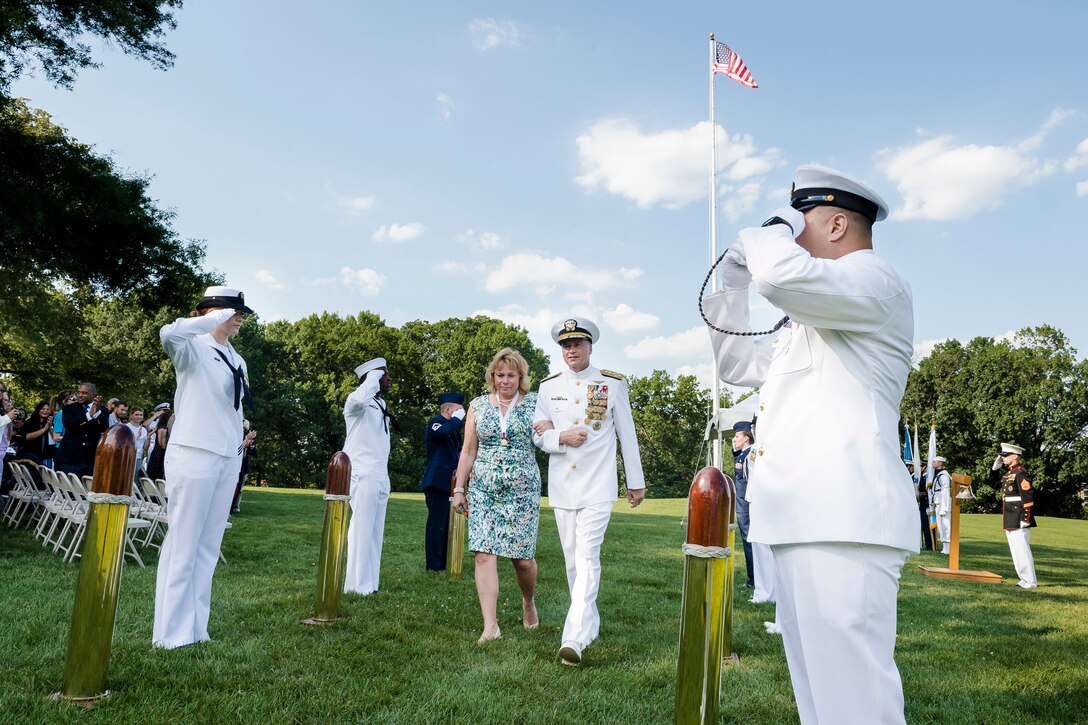 Navy Adm. James A. Winnefeld Jr., vice chairman of the Joint Chiefs of Staff, and his wife, Mary, exit Whipple Field at the conclusion of the admiral's retirement ceremony on Joint Base Myer-Henderson Hall, Va., July 31, 2015.