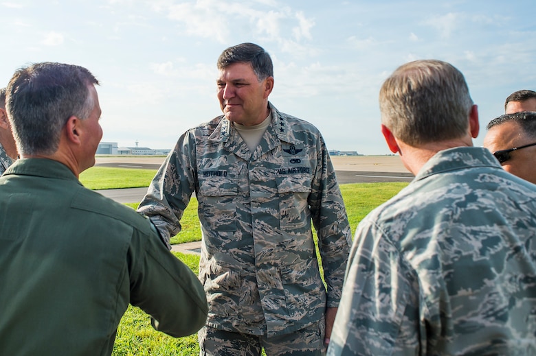 137th Air Refueling Wing Commander Col. Devin Wooden greets Lt. Gen. Bradley A. Heithold, Air Force Special Operations Command commander before a ribbon cutting ceremony at Will Rogers Air National Guard Base, Okla., Aug. 1, 2015. The Oklahoma guard unit celebrated the transition to AFSOC and the arrival of the MC-12W. (U.S. Air National Guard photo by Senior Airman Tyler Woodward/ Released) 