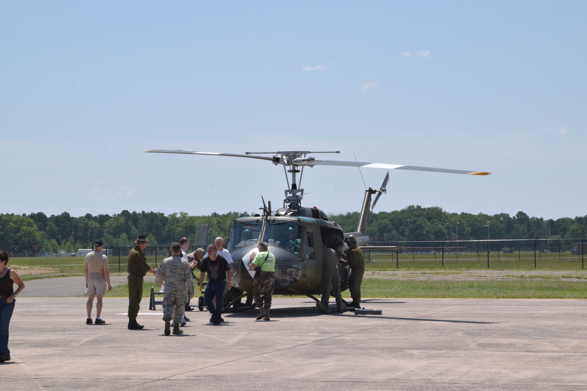 Guests were given an opportunity to take short flights in a  UH-1 Huey. The crew, veteran military pilots and technicians, work for American Huey 369, which travels across the country for military and aircraft commemorative events. (Photo by Staff Sgt. Benjamin Simon, JFHQ Public Affairs)