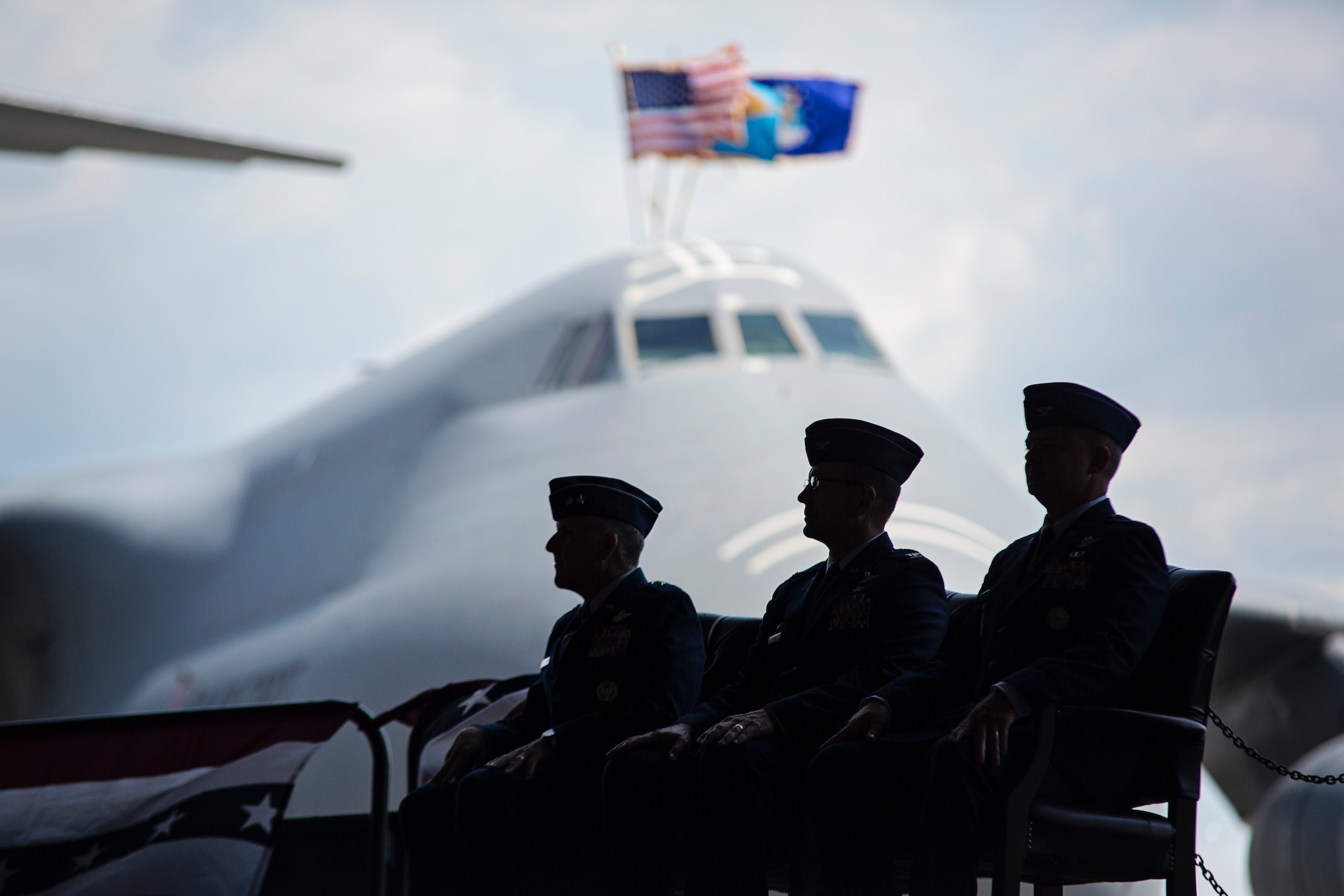 From left to right, Maj. Gen. John C. Flournoy Jr., 4th Air Force commander, Col. Raymond A. Kozak, outgoing 512th Airlift Wing commander, and Col. D. Scott Durham, incoming 512th Airlift Wing commander, listen to welcoming remarks at the 512th Airlift Wing change of command ceremony Aug. 1, 2015, on Dover Air Force Base, Del. Durham’s previous assignment was at the Pentagon, where he served as the deputy director for mobilization in the Office of the Assistant Secretary of Defense for Reserve Affairs. (U.S. Air Force photo by Capt. Bernie Kale)