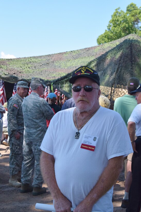 Charles Rutchick watched the commemoration opening ceremonies, July 11. Rutchick served as an infantryman in Vietnam from 1969-1970. (Photo by Staff Sgt. Benjamin Simon, JFHQ Public Affairs)