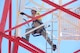 California Air National Guardsman Senior Master Sgt. David Solis, a communications superintendent assigned to the 129th Communications Flight, demonstrates safety precautions and climbing technique during an antenna tower training scenario at Lajes Air Base, Portugal, July 15, 2015. The guardsmen were tasked to decommission three towers during their one-week temporary duty assignment. (U.S. Air National Guard photo by Senior Airman Brian Jarvis)