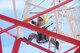California Air National Guardsman Senior Master Sgt. David Solis, a communications superintendent assigned to the 129th Communications Flight, demonstrates safety precautions and climbing technique during an antenna tower training scenario at Lajes Air Base, Portugal, July 15, 2015. The guardsmen were tasked to decommission three towers during their one-week temporary duty assignment. (U.S. Air National Guard photo by Senior Airman Brian Jarvis)