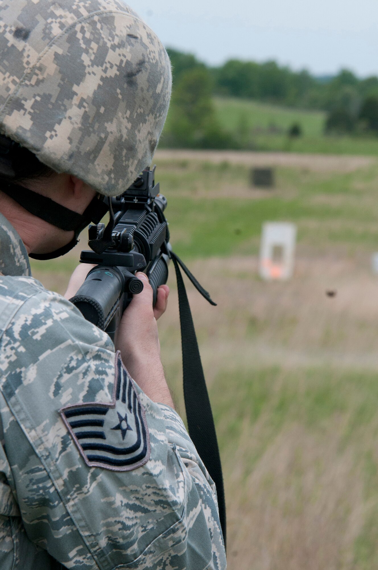 Tech Sgt. Bucky Harris, a Combat Arms Training and Maintenance team member from the Kentucky Air National Guard's 123rd Security Forces Squadron, fires practice rounds from the M203 grenade launcher during annual weapons qualifications training at Fort Knox, Kentucky, May 17, 2015. (U.S. Air National Guard photo by Staff Sgt. Vicky Spesard)