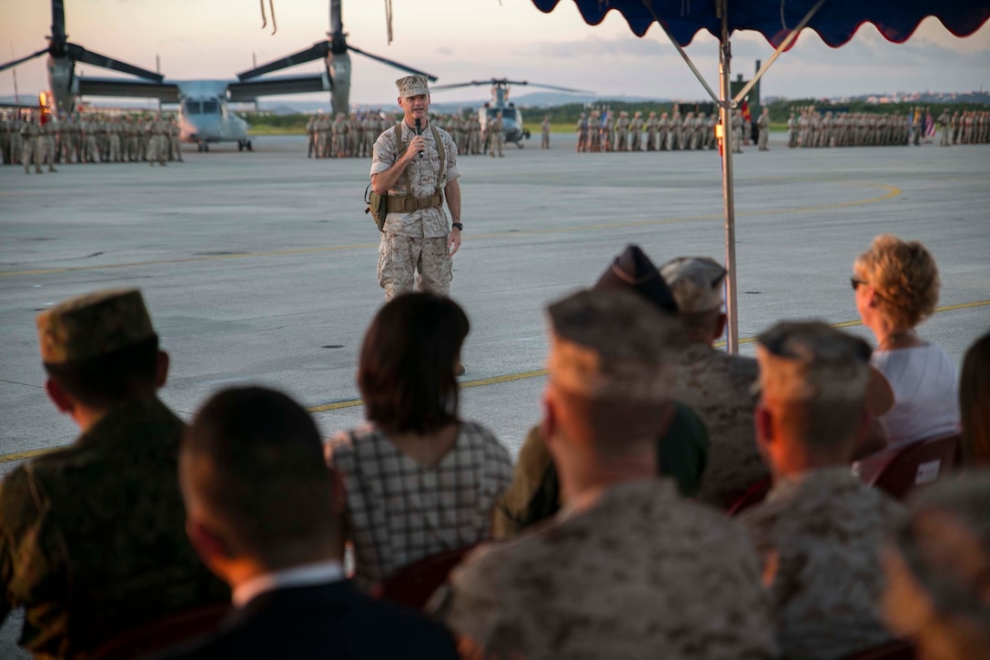 Brigadier Gen. Russell A. Sanborn speaks to the 1st Marine Aircraft Wing as their commanding general for the first time after a change of command ceremony at Marine Corps Air Station Futenma, Okinawa, Japan, July 30, 2015. Sanborn recently served as the director of Marine and Family Programs in Quantico, Virginia. Sanborn assumed command of the wing from Maj. Gen. Steven R. Rudder who will become the director of J5 Strategic Planning and Policy Directorate, Pacific Command. (U.S. Marine Corps photo by Cpl. Devon Tindle/Released)