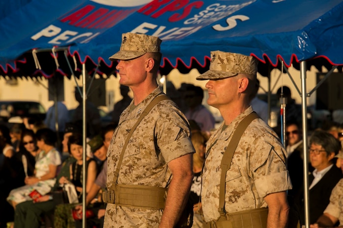 Brigadier Gen. Russell A. Sanborn, right, stands in front of 1st Marine Aircraft Wing with Maj. Gen. Steven R. Rudder, before assuming command of the wing during a ceremony at Marine Corps Air Station Futenma, Okinawa, Japan, July 30, 2015. Sanborn recently served as the director of Marine and Family Programs in Quantico, Virginia. Rudder will become the director of J5 Strategic Planning and Policy Directorate, Pacific Command. (U.S. Marine Corps photo by Cpl. Devon Tindle/Released)