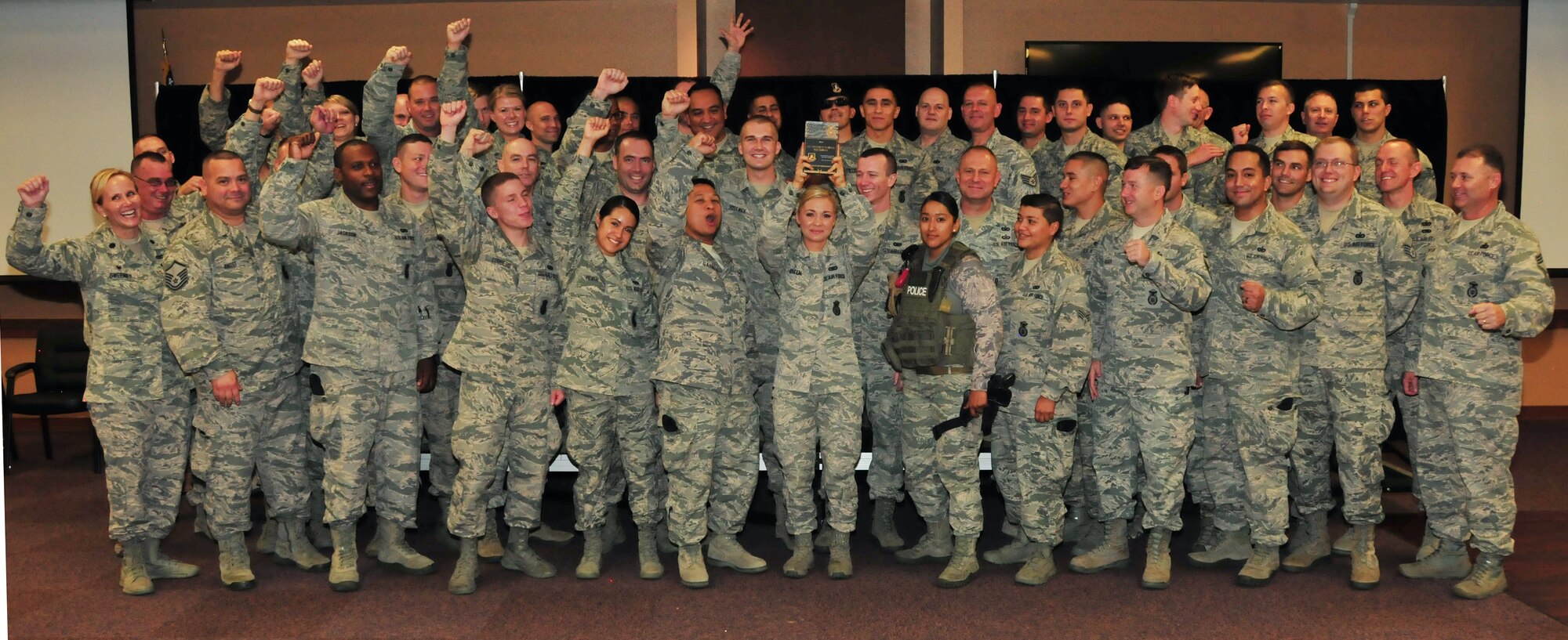The 161st Security Forces Squadron is awarded the Air National Guard Security Forces Squadron of the Year for 2014 at the Phoenix Air National Guard Base, Aug. 1. “Your nomination package showed us you are a well-rounded unit. You are very active in your federal mission, fully engaged in your state, and committed to your community. In other words, you’re an outstanding example of what the Air National Guard is all about and we are very proud of you,” said Chief Master Sgt. Todd Miskelly, Air National Guard Security Forces career field manager. (U.S. Air National Guard photo by Tech. Sgt. Courtney Enos)