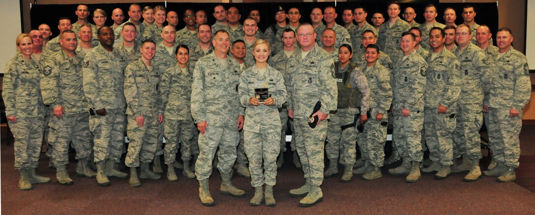 The 161st Security Forces Squadron is awarded the Air National Guard Security Forces Squadron of the Year for 2014 at the Phoenix Air National Guard Base, Aug. 1. “Your nomination package showed us you are a well-rounded unit. You are very active in your federal mission, fully engaged in your state, and committed to your community. In other words, you’re an outstanding example of what the Air National Guard is all about and we are very proud of you,” said Chief Master Sgt. Todd Miskelly, Air National Guard Security Forces career field manager. (U.S. Air National Guard photo by Tech. Sgt. Courtney Enos)