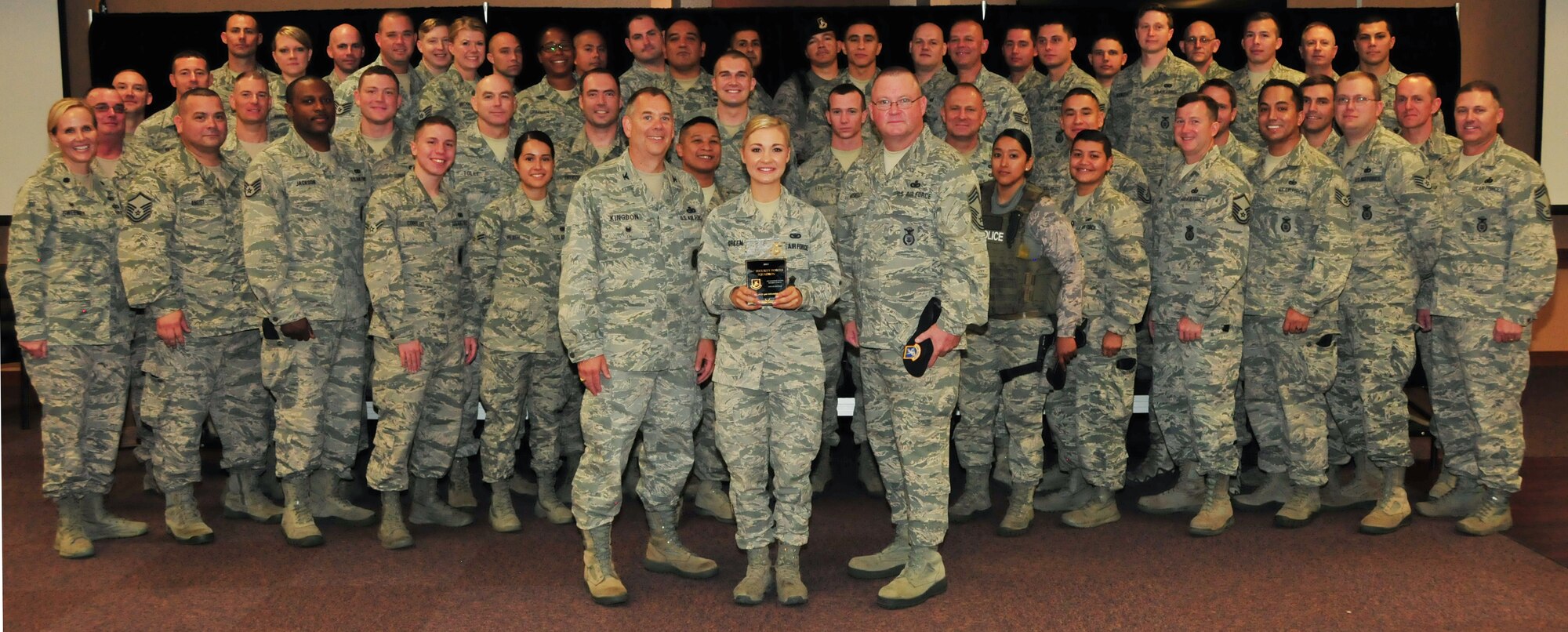 The 161st Security Forces Squadron is awarded the Air National Guard Security Forces Squadron of the Year for 2014 at the Phoenix Air National Guard Base, Aug. 1. “Your nomination package showed us you are a well-rounded unit. You are very active in your federal mission, fully engaged in your state, and committed to your community. In other words, you’re an outstanding example of what the Air National Guard is all about and we are very proud of you,” said Chief Master Sgt. Todd Miskelly, Air National Guard Security Forces career field manager. (U.S. Air National Guard photo by Tech. Sgt. Courtney Enos)