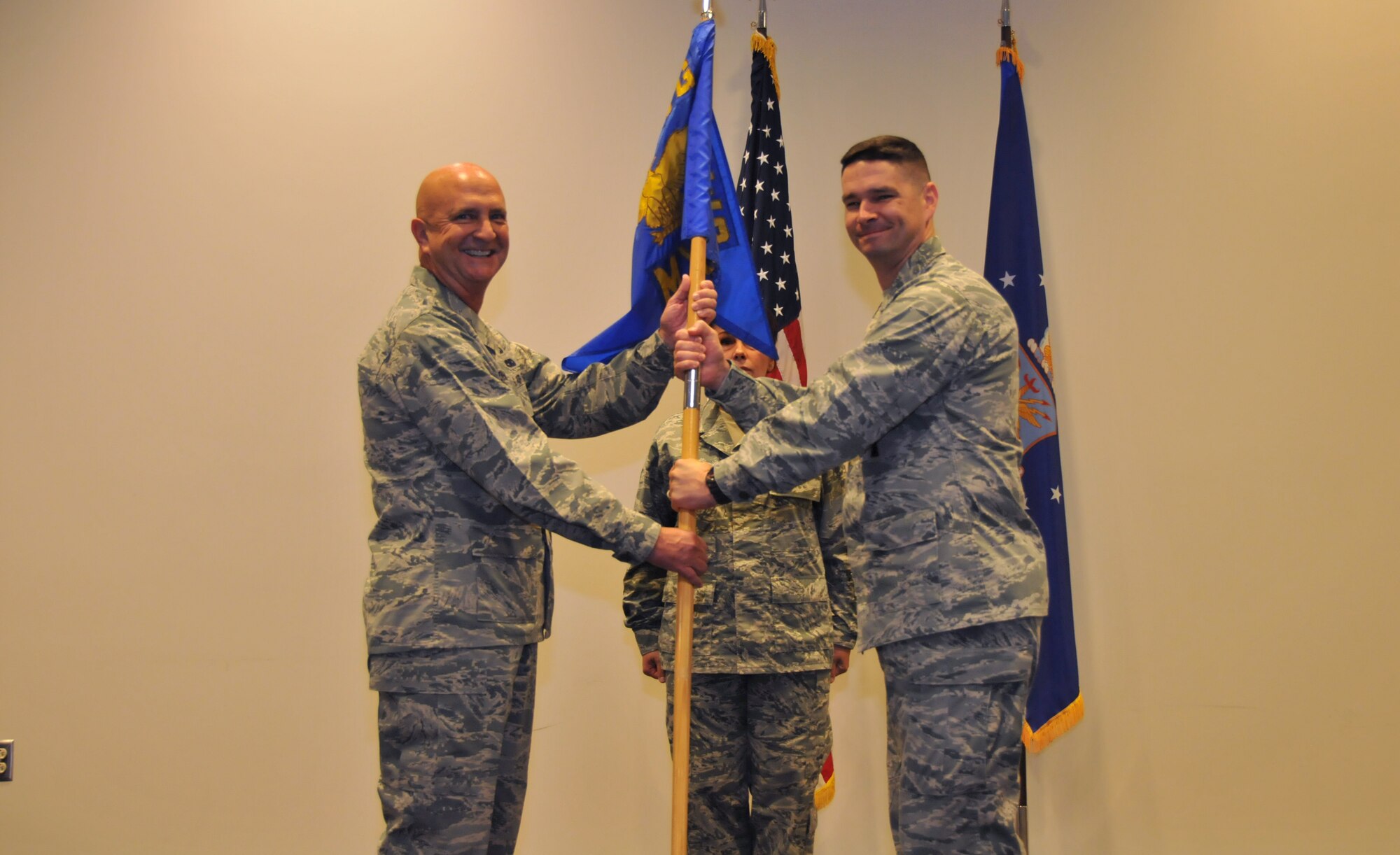 Lt. Col. Jay D. Johnson, 403rd Maintenance Group commander, hands the 403rd Maintenance Squadron guidon to Maj. Quinton L. Sasnett, who assumed command of the 403rd MXS Aug. 2, 2015, at Keesler Air Force Base, Mississippi. Sasnett was recently the commander of the 403rd Civil Engineer Squadron prior to its inactivation in July 2015. (U.S. Air Force photo/Staff Sgt. Nicholas Monteleone)