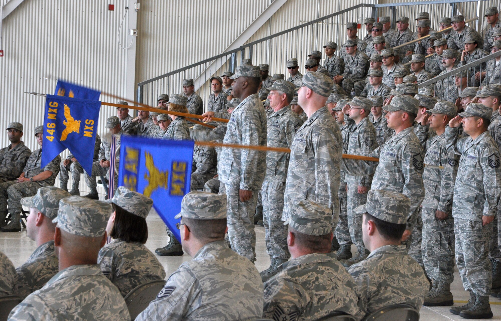 The squadrons of the 446th Maintenance Group render their first, official salute to Col. Kirk Peddicord who took command of the group during a change of command ceremony at Joint Base Lewis-McChord, Wash., Aug. 1, 2015. Peddicord, who's previous assignment was at Headquarters, Air Mobility Command, took command of the 446th MXG from Col. Alan Lerner. Lerner, who arrived at the 446th MXG in September 2011, retired from the Air Force Reserve. (U.S. Air Force photo/2nd Lt. Stephen J. Collier)