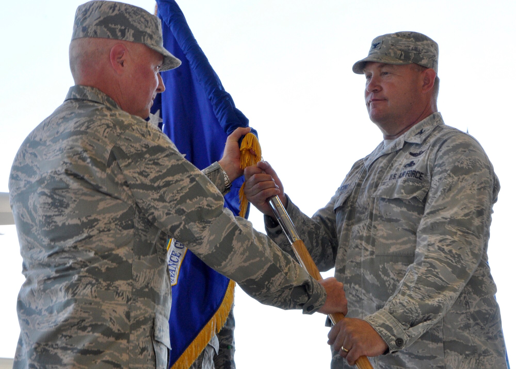 Col. Kirk Peddicord jokes around with Cols. Scott McLaughlin (far left) and Alan Lerner prior to a change of command ceremony at Joint Base Lewis-McChord, Wash., Aug. 1, 2015. Peddicord, who's previous assignment was at Headquarters, Air Mobility Command, took command of the 446th Maintenance Group from Col. Alan Lerner. Lerner, who arrived at the 446th MXG in September 2011, retired from the Air Force Reserve. McLaughlin is the commander of the 446th Airlift Wing. McLaughlin is the commander of the 446th Airlift Wing. (U.S. Air Force photo/2nd Lt. Stephen J. Collier)