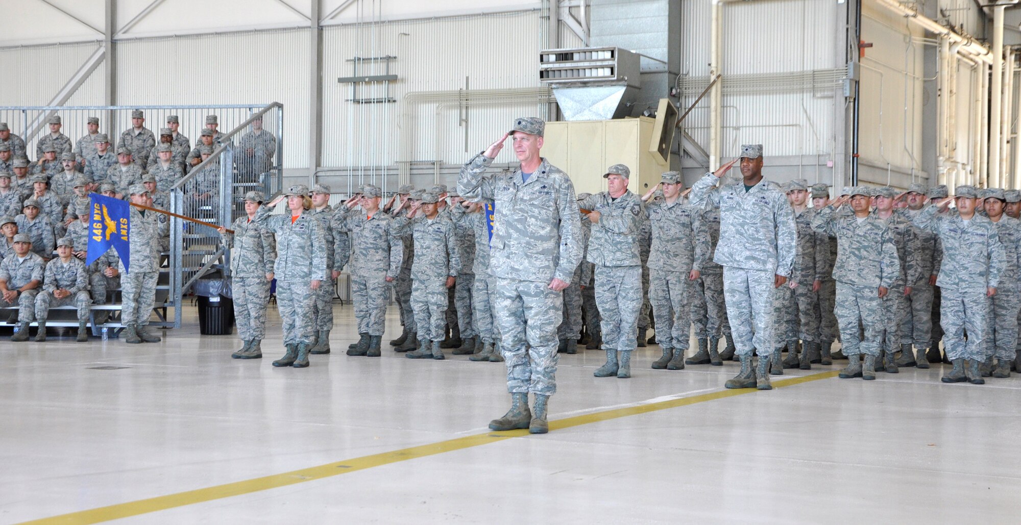 The squadrons of the 446th Maintenance Group render their final salute to group's outgoing commander, Col. Alan Lerner, during a change of command ceremony at Joint Base Lewis-McChord, Wash., Aug. 1, 2015. Lerner passed the mantle of 446th MXG leadership to Col. Kirk Peddicord, who's previous assignment was at Headquarters, Air Mobility Command. Lerner, who arrived at the 446th MXG in September 2011, retired from the Air Force Reserve. McLaughlin is the commander of the 446th Airlift Wing. (U.S. Air Force photo/2nd Lt. Stephen J. Collier)