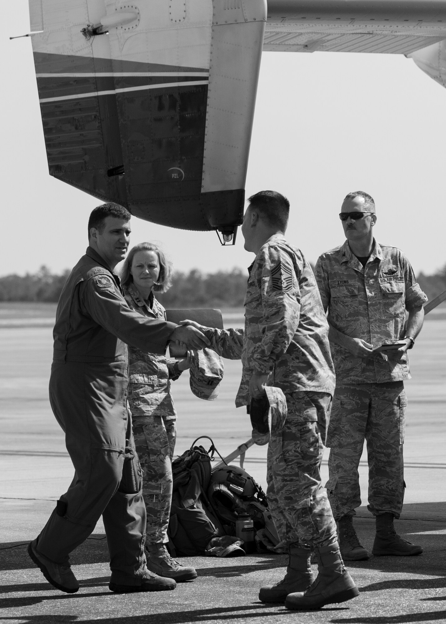 Air Force Reserve Major Ethan Hinkins, 711th Special Operations Squadron, left, welcomes Chief Master Sgt. Brian Bischoff, the 919th Special Operations Wing's new command chief, to the flightline during a Q&A regarding the Combat Aviation Advisor mission on the C-145 at Duke Field, Fla., August 1, 2015.  Duke Field's Reserve and active duty CAAs deploy to partner nations to train personnel to engage in air operations. (U.S. Air Force photo/Tech. Sgt. Jasmin Taylor)