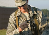 Master Sgt. Christopher Fusco, 111th Operations Support Squadron member with the 111th Attack Wing at Horsham Air Guard Station, Pennsylvania, prepares his rifle before the Governor’s Twenty marksmanship competition held July 25, 2015, Fort Indiantown Gap, Pennsylvania. Fusco placed third out of 82 contestants in the annual National Guard event. (U.S. Air National Guard submitted photo/Released)