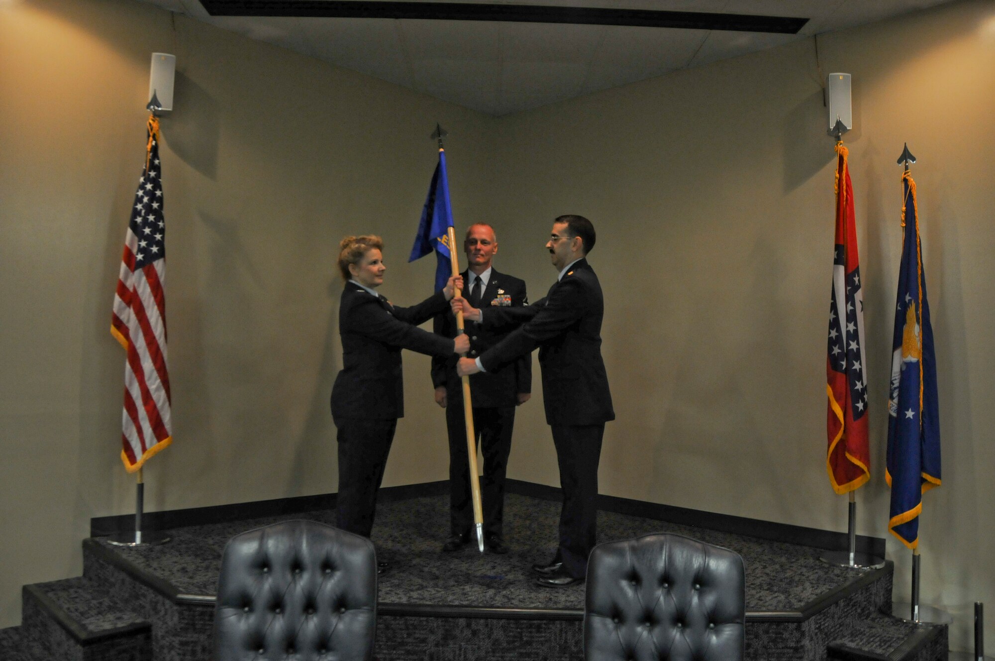 Maj. Micheal Howard receives the 188th Civil Engineer Squadron guidon from Col. Tenise Gardner, 188th Mission Support Group commander, during a formal change of command ceremony held Aug. 1, 2015 at Ebbing Air National Guard Base, Fort Smith, Ark. Howard assumed command of the 188th CES which encompasses multiple career fields dedicated to basic engineer services that help maintain the installation. (U.S. Air National Guard photo by Senior Airman Cody Martin)