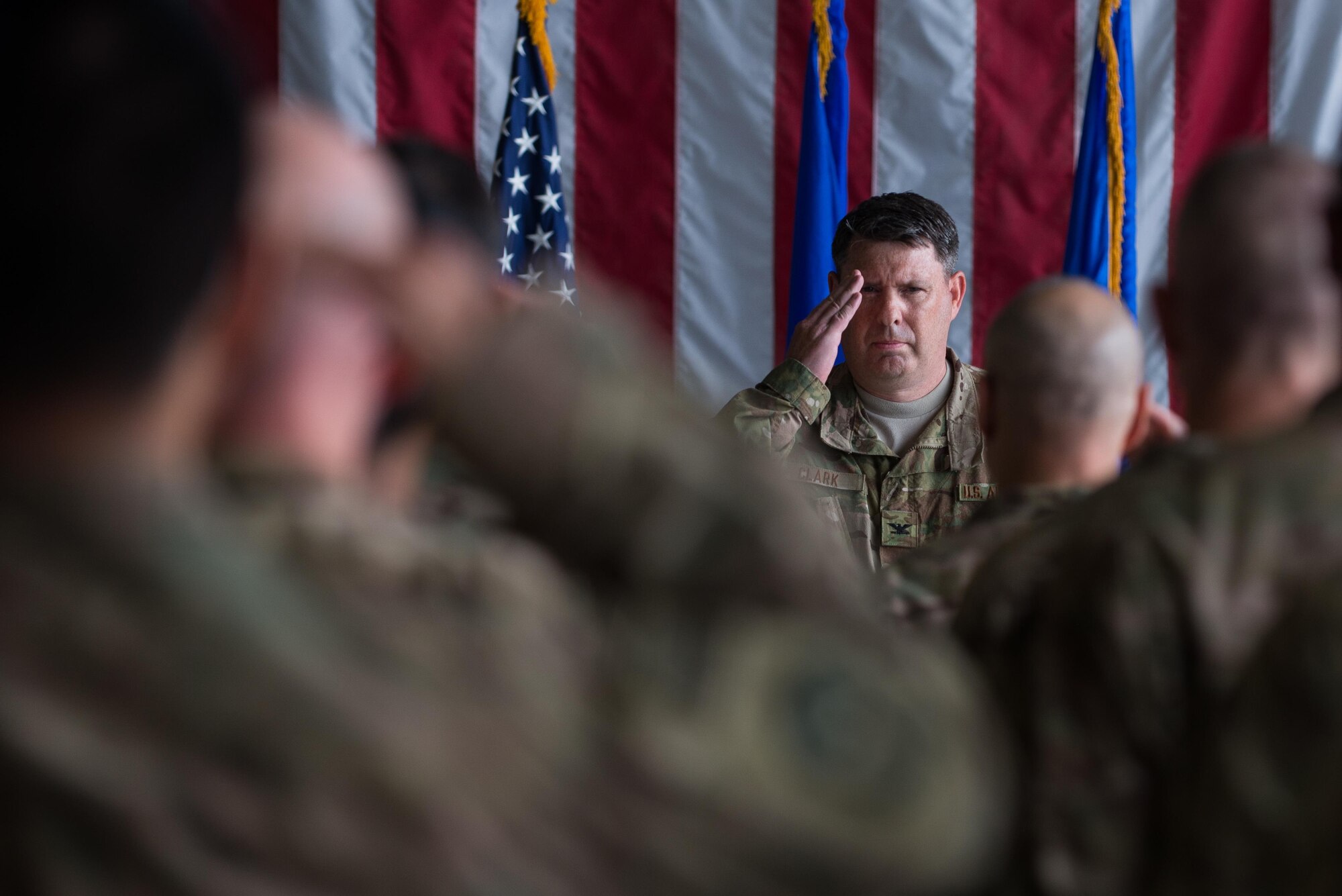U.S. Air Force Col. William Clark, 455th Expeditionary Mission Support Group commander, salutes for the first time as commander during the 455th EMSG change of command ceremony at Bagram Airfield, Afghanistan, Aug. 3, 2015. The 455th MSG is comprised of five squadrons responsible for communications, civil engineer operations, force support, logistics readiness, and security forces. (U.S. Air Force photo by Tech. Sgt. Joseph Swafford/Released)