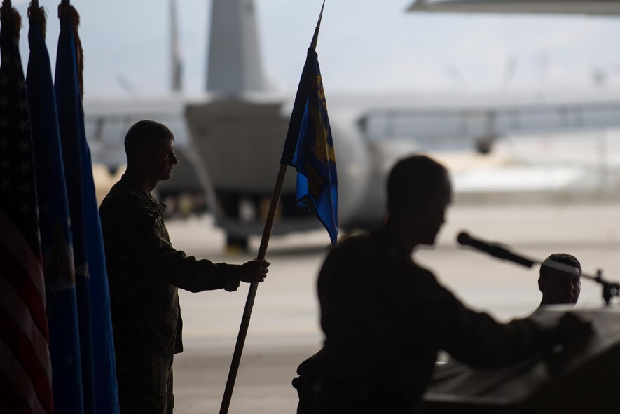 U.S. Air Force Chief Master Sgt. David Belcher, 455th Expeditionary Mission Support Group chief, holds the guidon during the 455th Expeditionary Mission Support Group change of command ceremony at Bagram Airfield, Afghanistan, Aug. 3, 2015. The 455th MSG is comprised of five squadrons responsible for communications, civil engineer operations, force support, logistics readiness, and security forces. (U.S. Air Force photo by Tech. Sgt. Joseph Swafford/Released)
