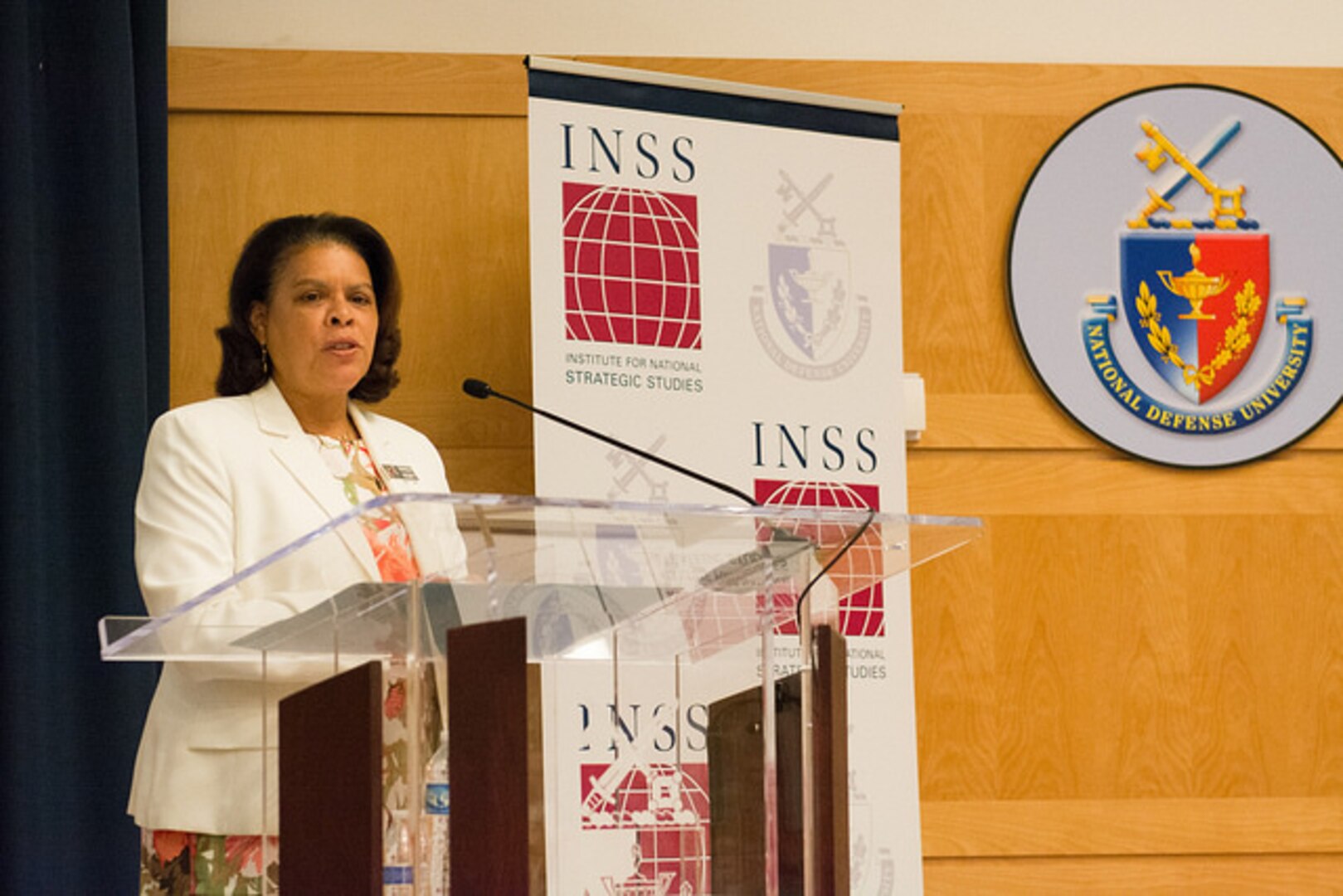 Ambassador Wanda Nesbitt gives welcoming remarks the symposium