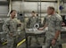 Tech. Sgt. Travis Yeager, 33rd Maintenance Squadron metal technician section chief, explains the capabilities of the Nacelle vent stiffener to Chief Master Sgt. of the Air Force James Cody his squadron’s coin at Eglin Air Force Base, Fla., July 30, 2015. The 33rd MXS took initiative to craft their own Nacelle vent stiffener to keep the F-35 Lightening II program moving forwards towards initial operations capabilities. (U.S. Air Force Photo/Senior Airman Andrea Posey)