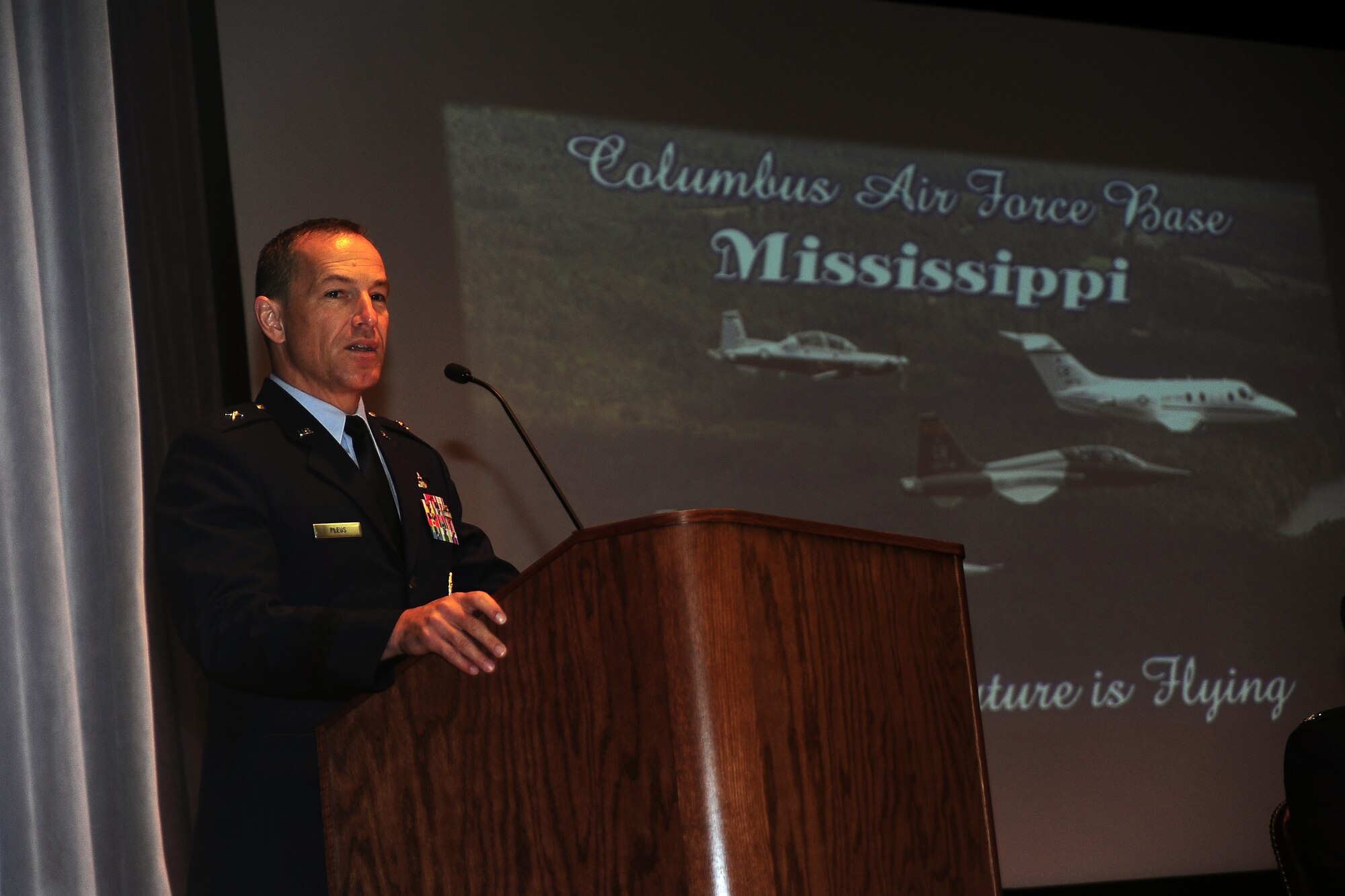 Brig. Gen. Scott Pleus, 56th Fighter Wing Commander, speaks to Columbus Air Force Base’s newest pilots July 24 in the Kaye Auditorium on Columbus Air Force Base, Mississippi. Pleus returned to Columbus AFB in an F-35 after graduating from here 24 years ago, to display the new aircraft to young aviators. (U.S. Air Force photo by Airman 1st Class Daniel Lile)