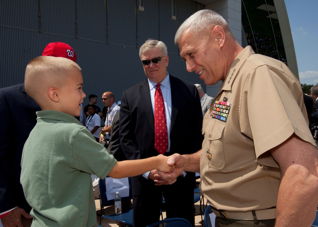The Assistant Commandant of the U.S. Marine Corps, Gen. John M. Paxton, Jr., right, poses for a photo during the Boeing Vertol CH-46 Sea Knights final flight and Retirement Ceremony at the Smithsonian Institution National Air and Space Museum, Steven F. Udvar-Hazy Center, in Chantilly, Va., Aug. 1, 2015. (U.S. Marine Corps photo by Sgt. Tia Dufour/Released)