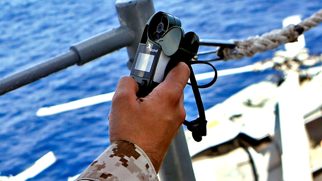 U.S. Marine Cpl. Justin R. Seddon, a meteorology/oceanography specialist with the 26th Marine Expeditionary Unit, uses a Kestrel portable weather device to collect weather data during a Composite Training Unit Exercise aboard the USS Kearsarge July 27, 2015. The Kestrel has built in measurement devices that determine wind speed, air pressure and temperature. The 26th MEU and Amphibious Squadron 4 are conducting a COMPTUEX to earn certification for their deployment to the 5th and 6th Fleet areas of responsibility later this year.