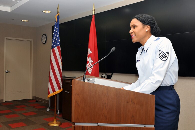 Reserve Air Force Tech Sgt. Monica F. White speaks to a crowd of employees from the U.S. Army Corps of Engineers Nashville District during her promotion ceremony at the district headquarters in the Estes Kefauver Federal Building June 9, 2015.  